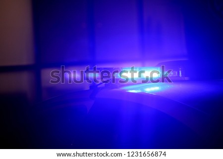 blue police car light in the night