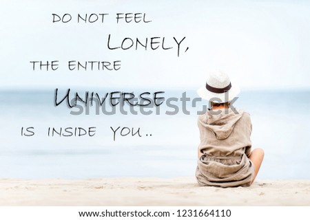 Do not feel lonely-universe inside you. Woman looking at the sea. Inspirational motivational quote. Outdoors horizontal filtered image