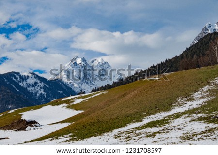 Winter in the austrian alps. Snowy Mountains and blue sky landscape.