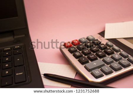 computer calculator and a black pen in the office
