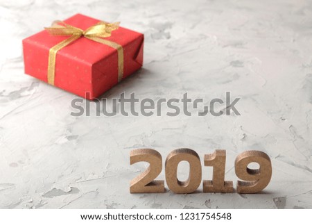 New Year 2019. Christmas. Vacation. Composition with numbers 2019 and Christmas gifts close-up on a light background