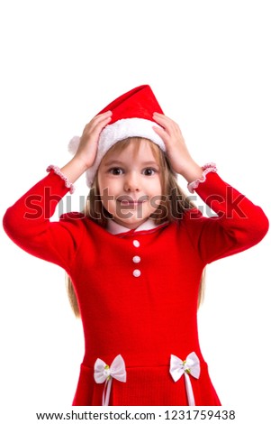 Puzzled smiling christmas girl wearing a santa hat isolated over a white background, holding her hands on the head. Portrait picture