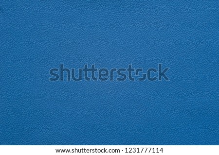 Bright blue artificial leather with large texture. Royalty-Free Stock Photo #1231777114