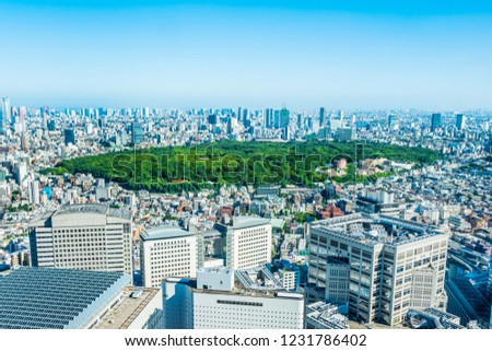 Asia Business concept for real estate and corporate construction - panoramic modern city skyline aerial view of shinjuku area under bright blue sky and sun in Tokyo, Japan