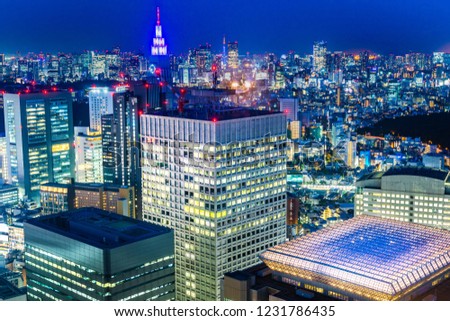 Asia Business concept for real estate and corporate construction - panoramic modern city skyline aerial night view of shinjuku area under twilight sky in Tokyo, Japan