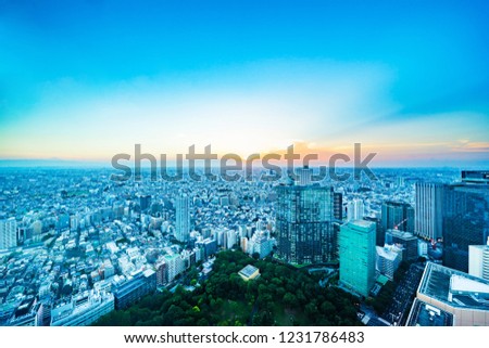 Asia Business concept for real estate and corporate construction - panoramic modern city skyline aerial view of shinjuku area under twilight sky and dramatic sunset in Tokyo, Japan