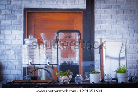 Accessories on the counter with glass jar and Coffee machine in Coffee Shop and Masonry Wall Scenes background.