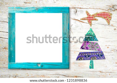 Xmas Nativity photo frame card. Christmas tree Star of Bethlehem made with fabric cutouts and isolated wooden frame for photo or greeting message on rustic wood