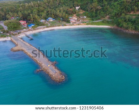 Aerial drone image of Beautiful white sandy beach with turquoise sea water and palm trees at Kuala Abai, Kota Belud, Sabah, Borneo