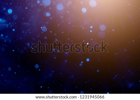 Blur blue bokeh of light on black background