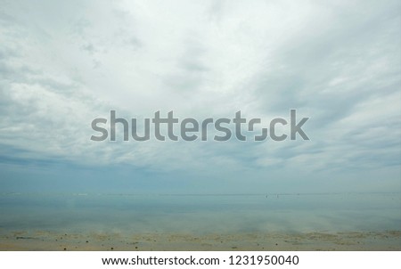 blurred background, morning sunrise on the sea, calm water, small island, journey