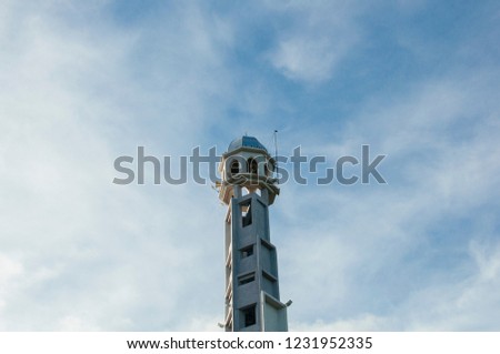 Mosque tower over the blue sky