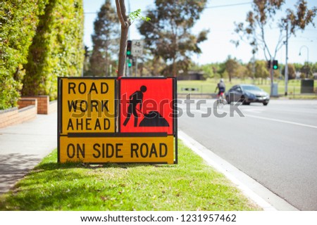 Road work sign. Australia, Melbourne. City street. 