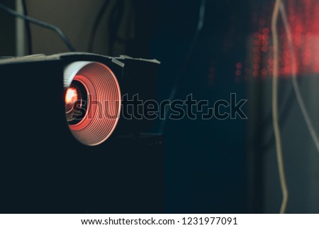Projector and red light bokeh background, Technology background.