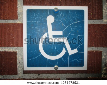 Handicapped Sign on Brick Wall