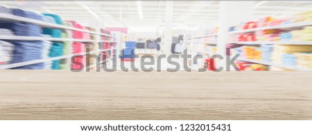 Wooden tables and supermarkets blur background, panoramic banner with customers shopping With empty and copy space,to place show item for show or advertisement for a website's headline.