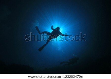 Scuba diving silhouette underwater