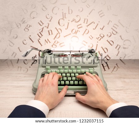 First person perspective elegant hand writing on typewriter with flying letters concept
