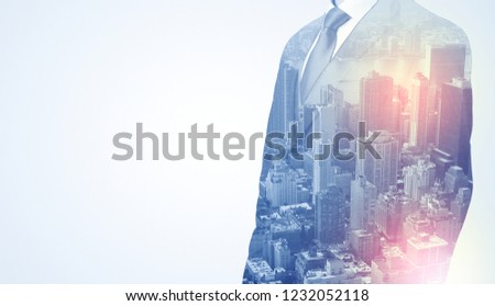 Businessman in suit standing thinking with metropolis graphic 
