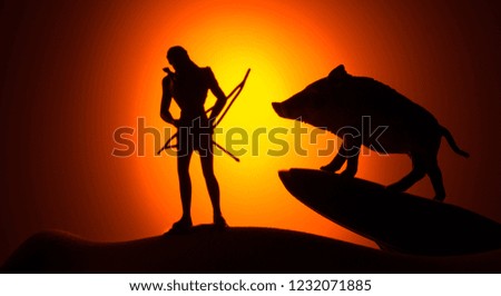 Silhouettes of animals on sunset background