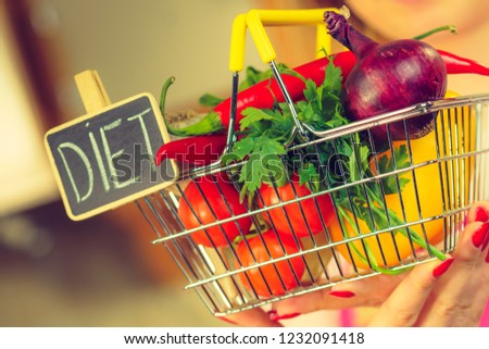 Shopping basket with diet sign and many colorful vegetables. Healthy eating lifestyle, vegetarian food.
