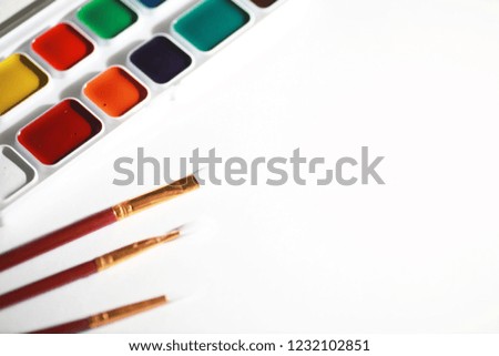 Stationery for drawing paints on a white sheet of paper
