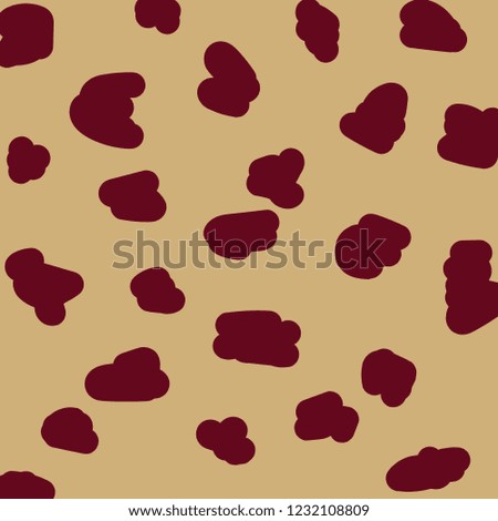 Animal pattern. Dark red spots on beige background. Fashion modern pattern.