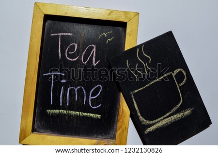 Drawing cup of tea and Tea Time on phrase colorful handwritten on blackboard white background. Education concept