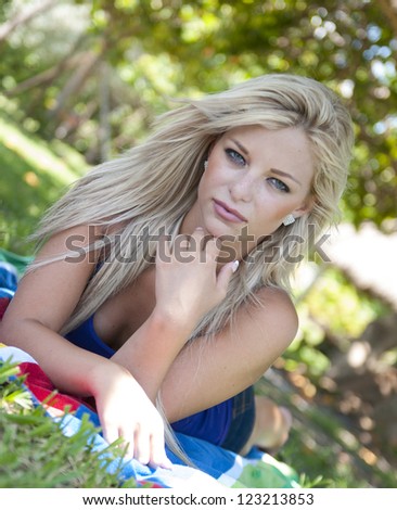 Beautiful young woman at a park