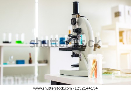 Picture of microscope with metal lens for research and medical equipment in laboratory