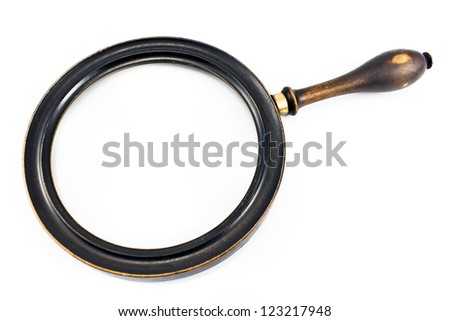 Antique magnifying glass isolated on white
