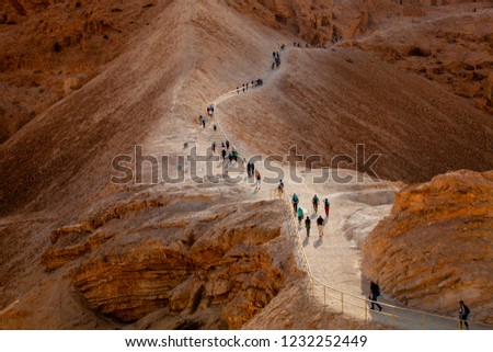 Line of tourists climbed on the Masada fortress rock  Royalty-Free Stock Photo #1232252449