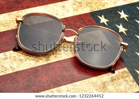 Leopard sunglasses placed on the flag of the United States