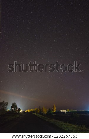 The road at night under the starry sky