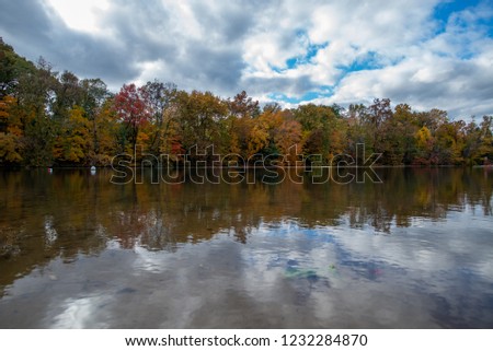 A beautiful reflection shot of fall trees on a lake