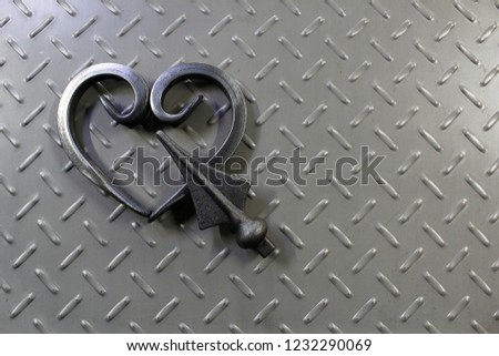 Stylized image of the heart, made of metal forged elements.