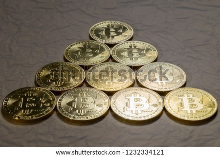 bitcoin coins on a gold background