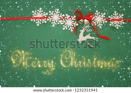 Christmas background with red silk traditional ribbon, white deer, and jingle bells