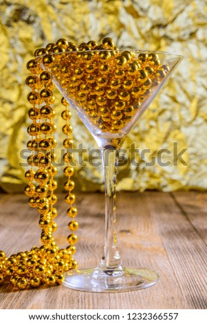 bright martini glass on a golden festive background
