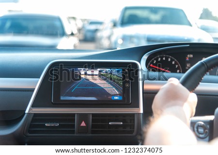 Rear View Monitor for car reverse system. Rear area image showing to driver by video camera at rear area to help for parking and prevent accident. Automotive safety technology equipment. Royalty-Free Stock Photo #1232374075