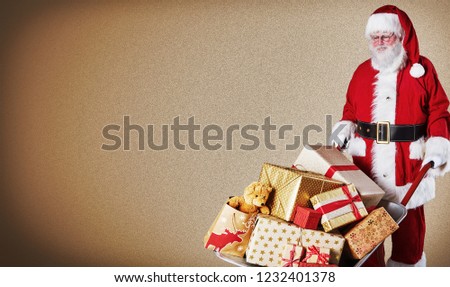 Father Christmas delivering a wheelbarrow of colorful wrapped gifts over a brown gradient background with copy space