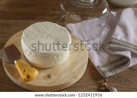 White and fresh cheese, on wooden table - traditional product of the State of Minas Gerais - Brazil.