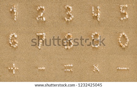 stone numbers of small stones on yellow sand