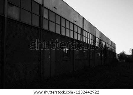 outside of a warehouse black and white