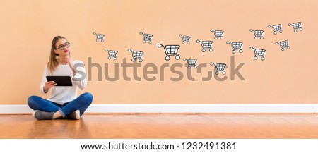 Online shopping with young woman holding a tablet computer