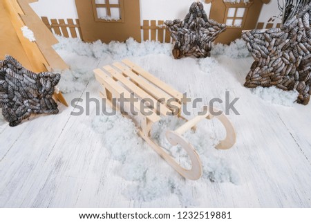 decorations made of cardboard, houses and sleds. new year photo zone