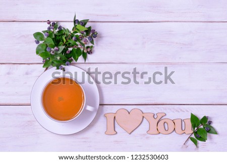 Cup of tea with hearts and the words "I love you" on a white background from the boards, Good morning card, Valentine's Day card