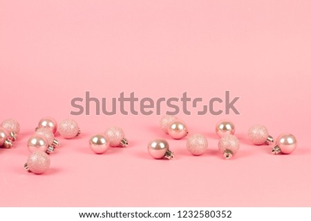 Fashion ?hristmas decoration on pink background. Closeup of pink christmas . Trendy minimal concep. pastel color