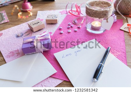 Packing a gift on a wooden table for a festive occasion