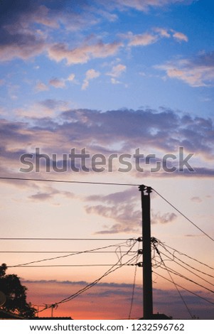 shadow of electricity pole in the sunset